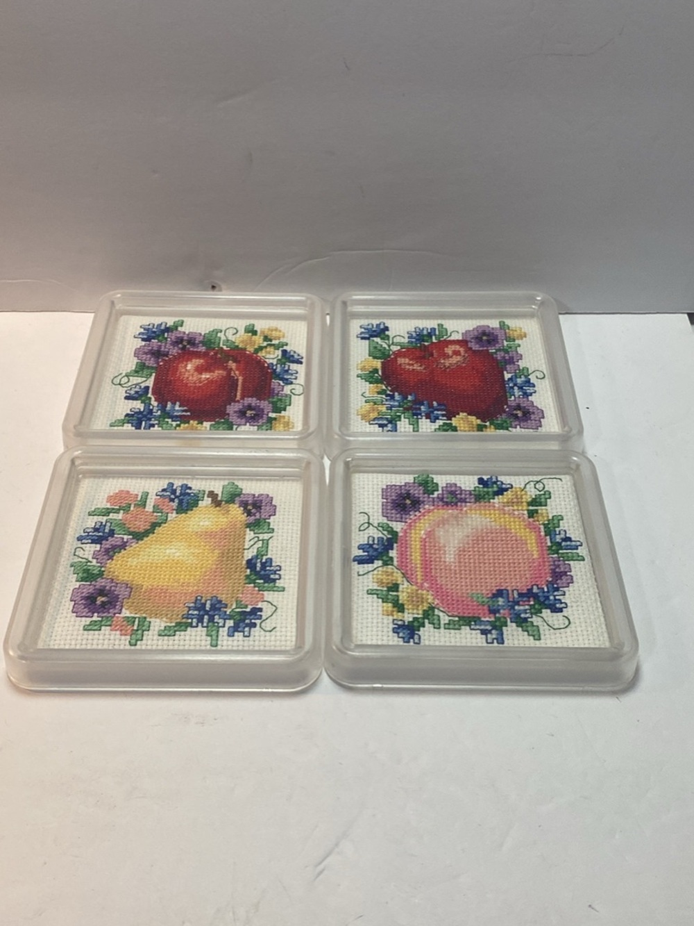 4 handmade cross-stitch acrylic coasters